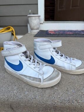 Nike White High-Top Sneakers with Blue Swoosh